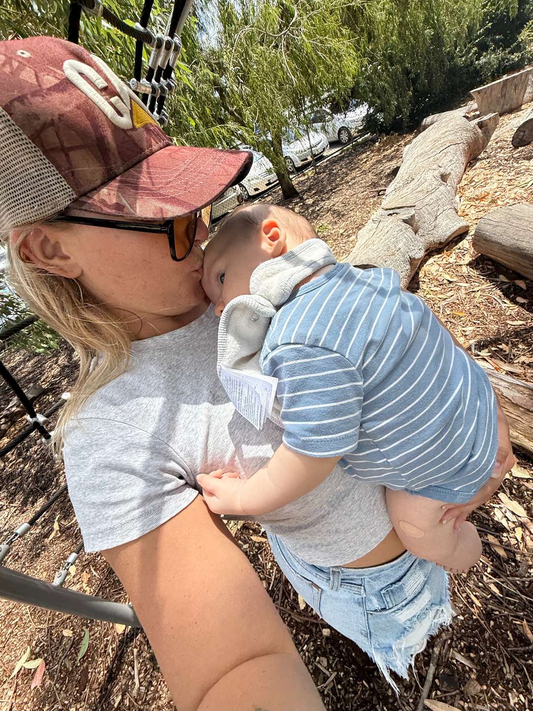 Ainsley kissing a baby's head