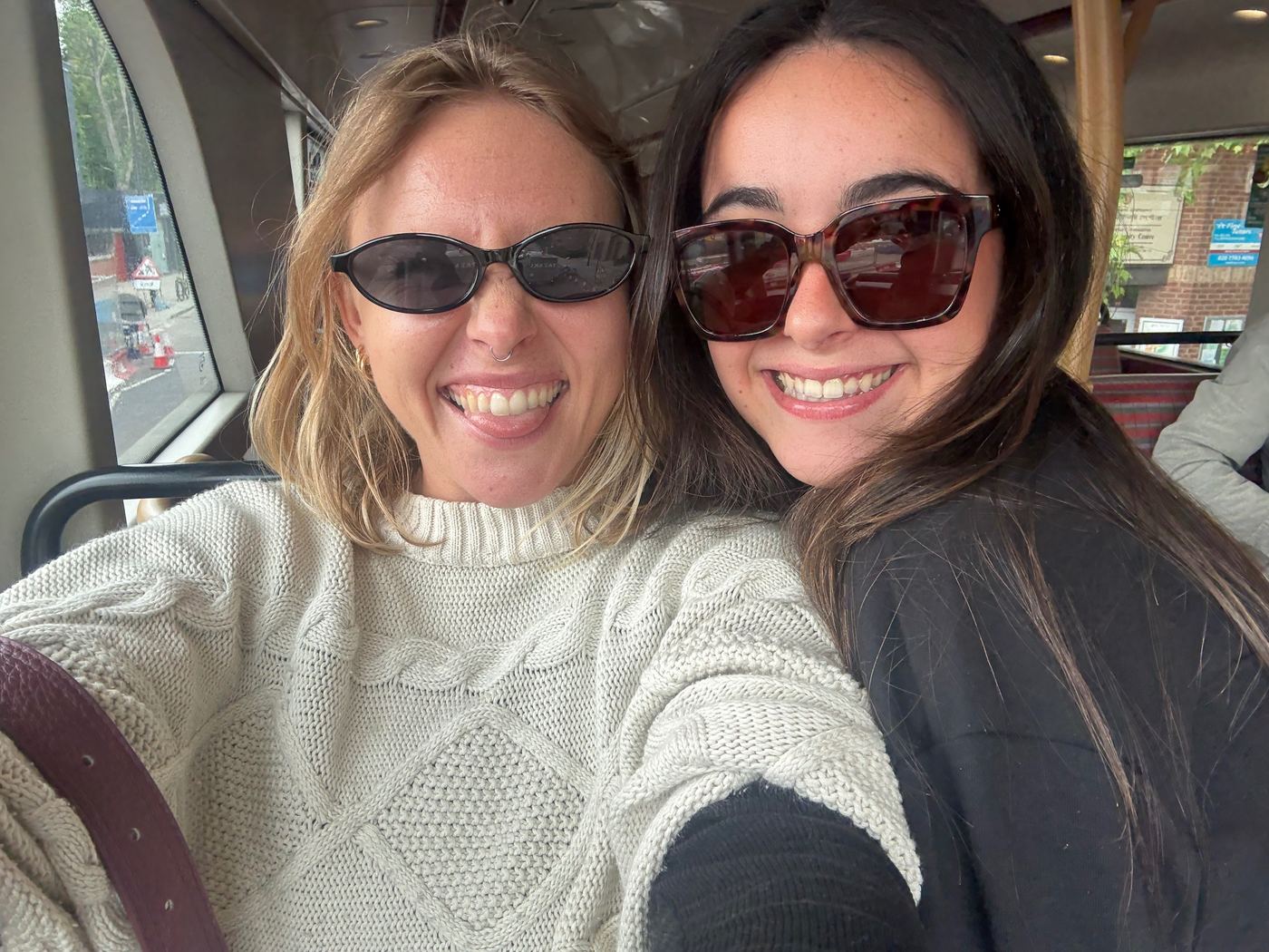 Ainsley and a friend on the top deck of a London bus