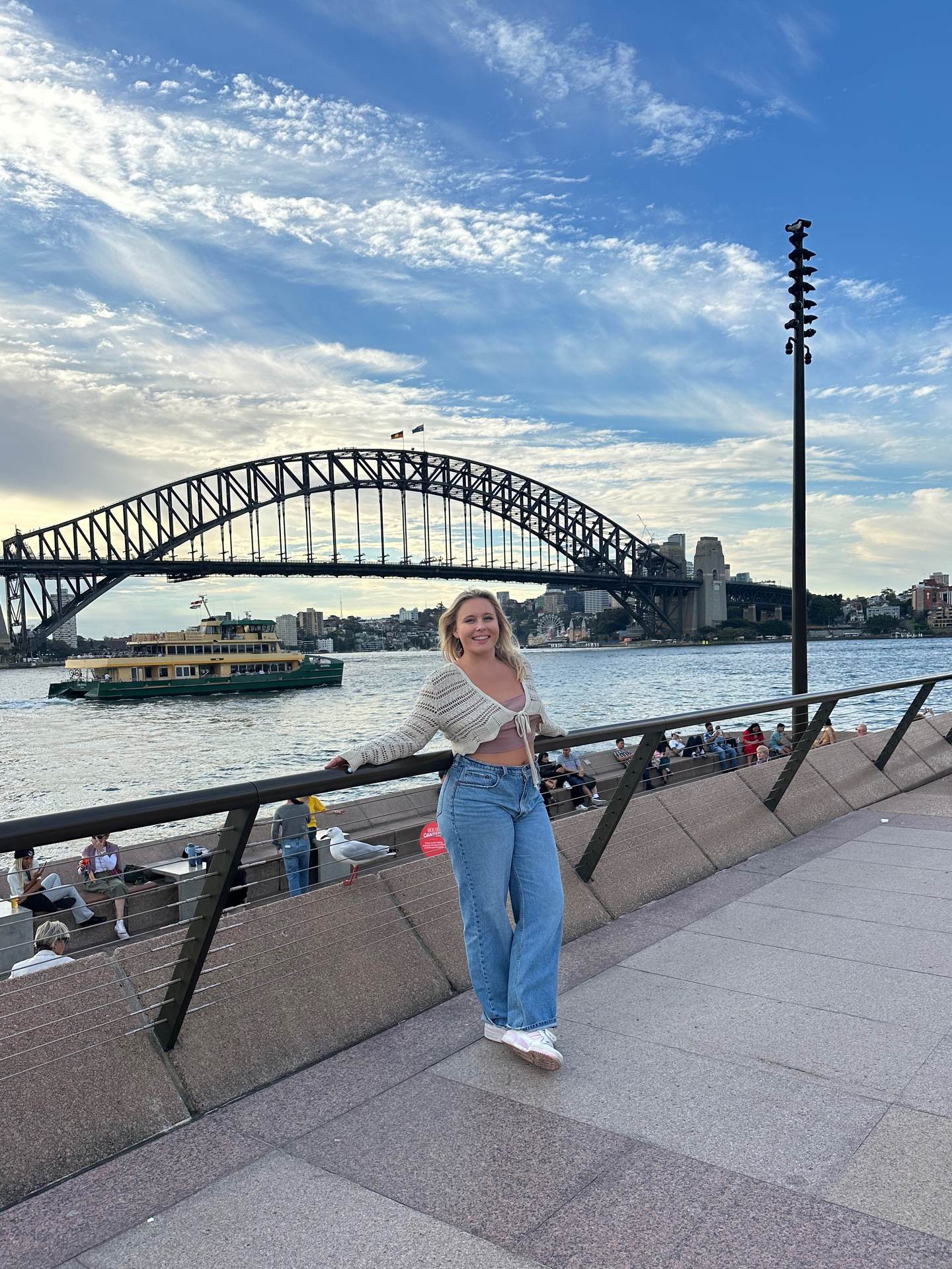 Ainsley at Sydney Harbour with the Harbour Bridge behind her