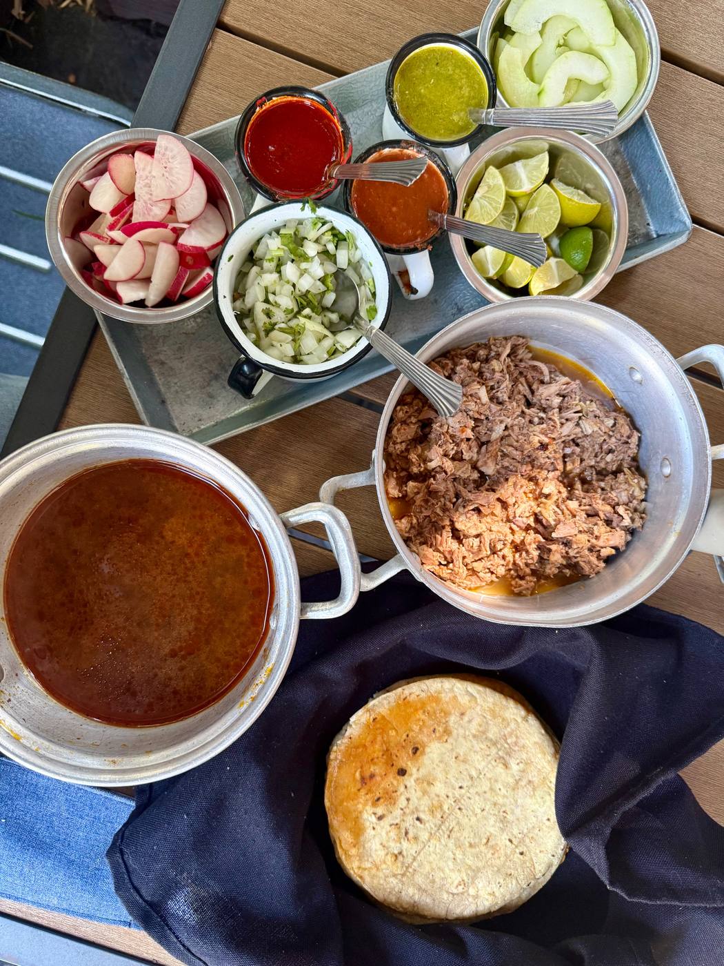 An overhead view of a Mexican meal laid out on a table